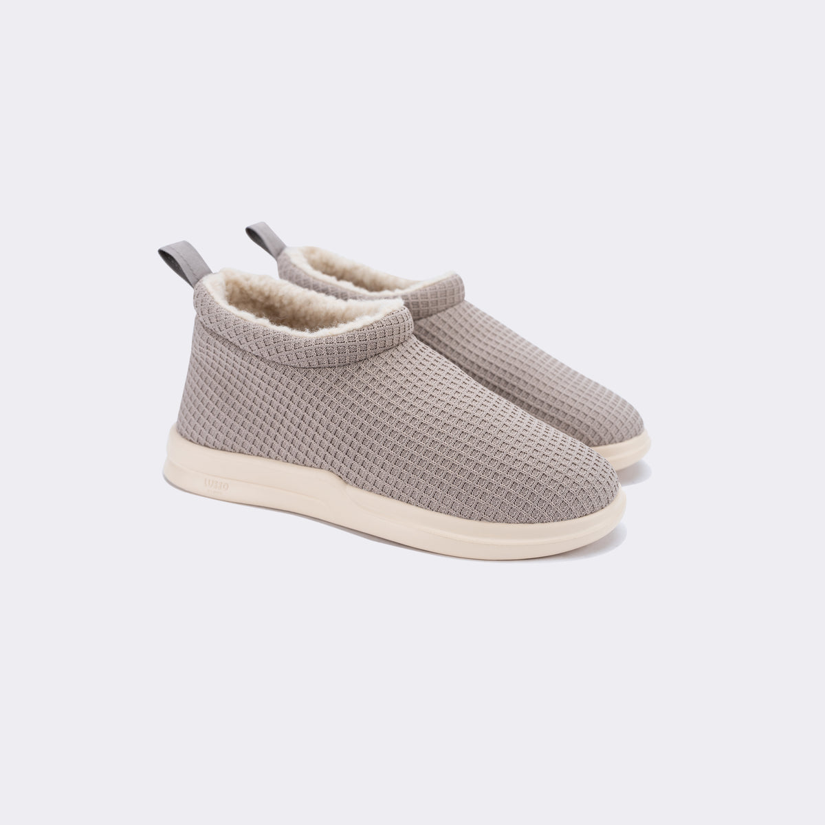 light grey shearling lined waffle knit slip on shoe with white sole 